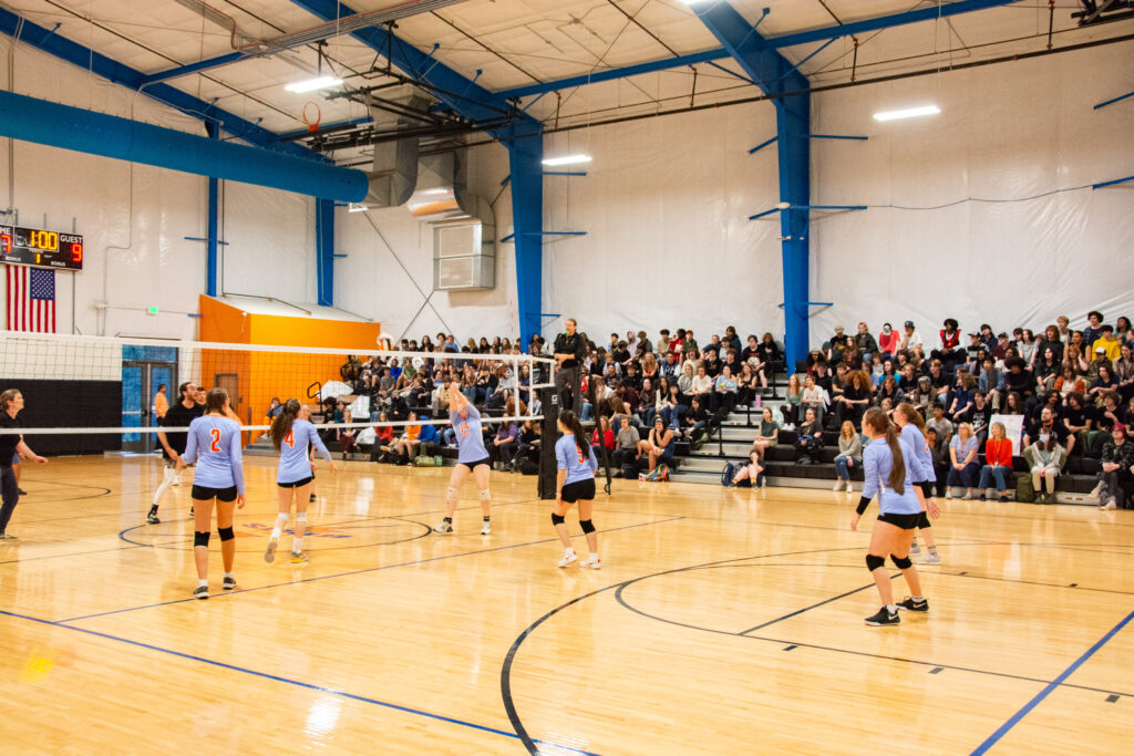 High School girls volleyball team plays a game in the Gymnasium at the Franklin School of Innovation